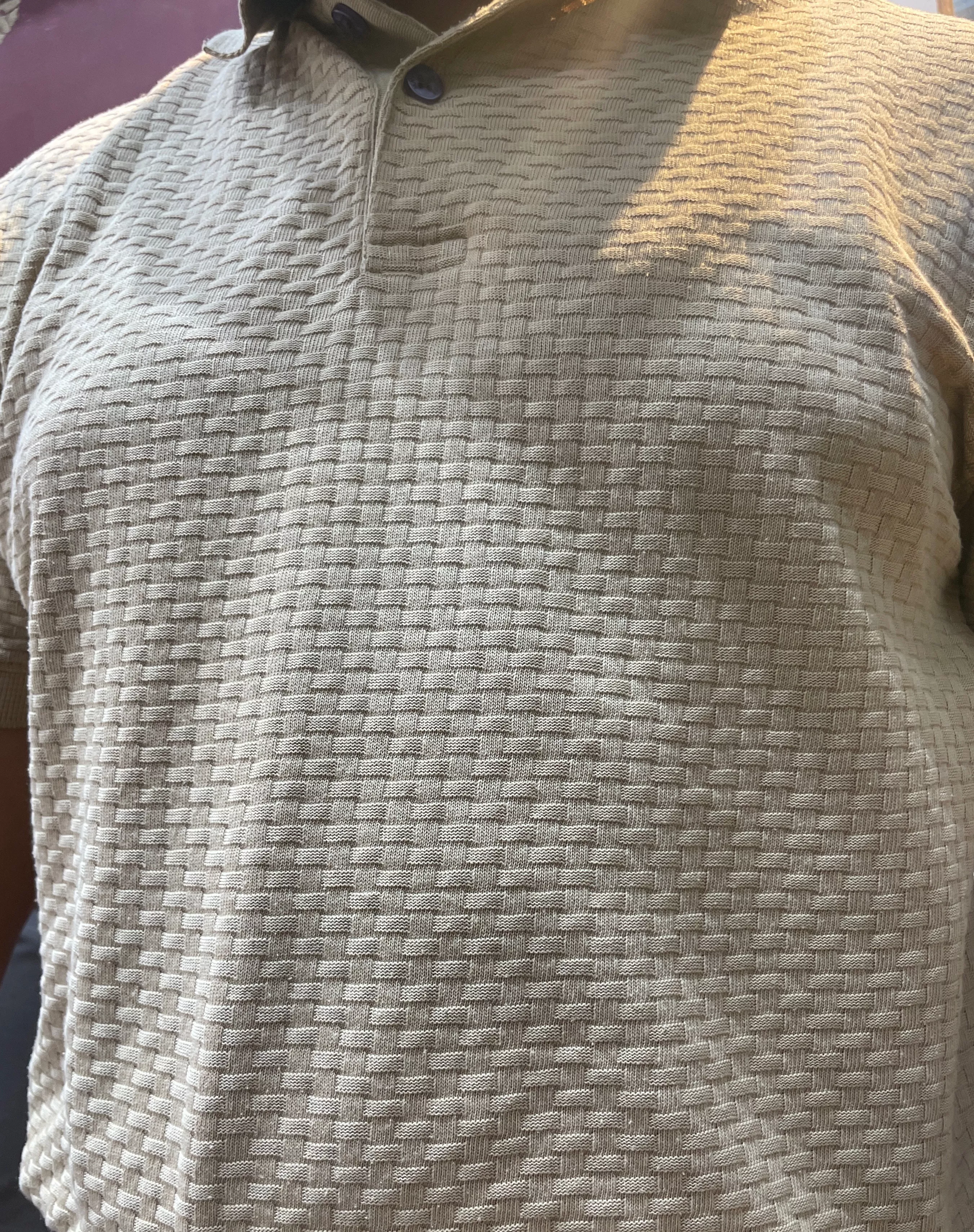 Beige polo shirt displayed on a mannequin in Hoshiarpur, showcasing its stylish design.